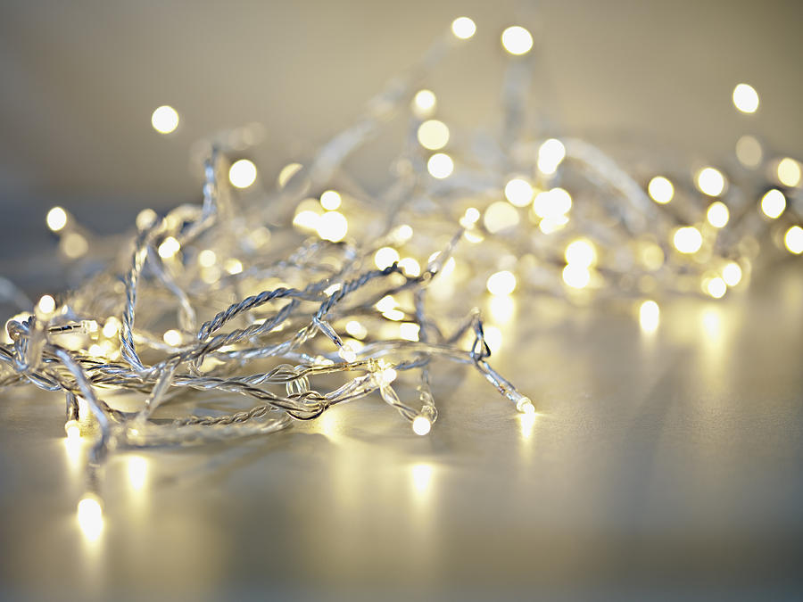 Pile of illuminated string lights Photograph by Martin Barraud