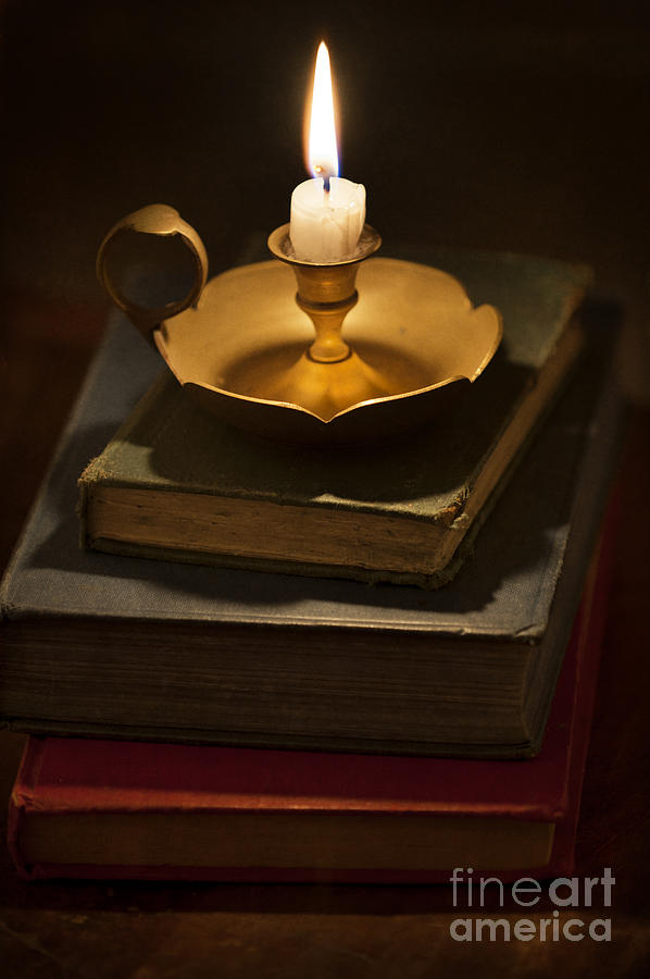 Still Life Photograph - Pile Of Vintage Books By Candle Light by Lee Avison