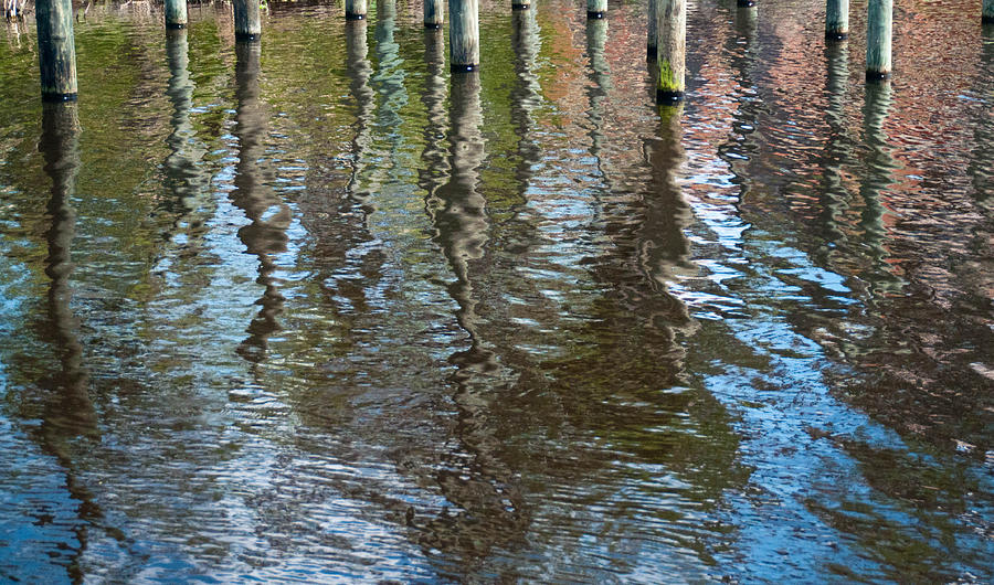Pilings Reflection Photograph by Geraldine Alexander