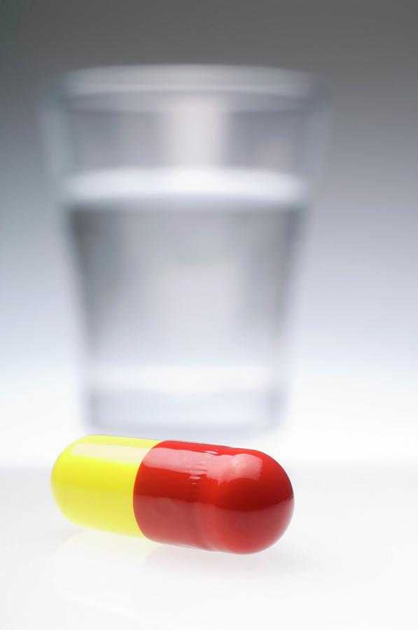 Drug Photograph - Pill And Glass Of Water by Daniel Sambraus