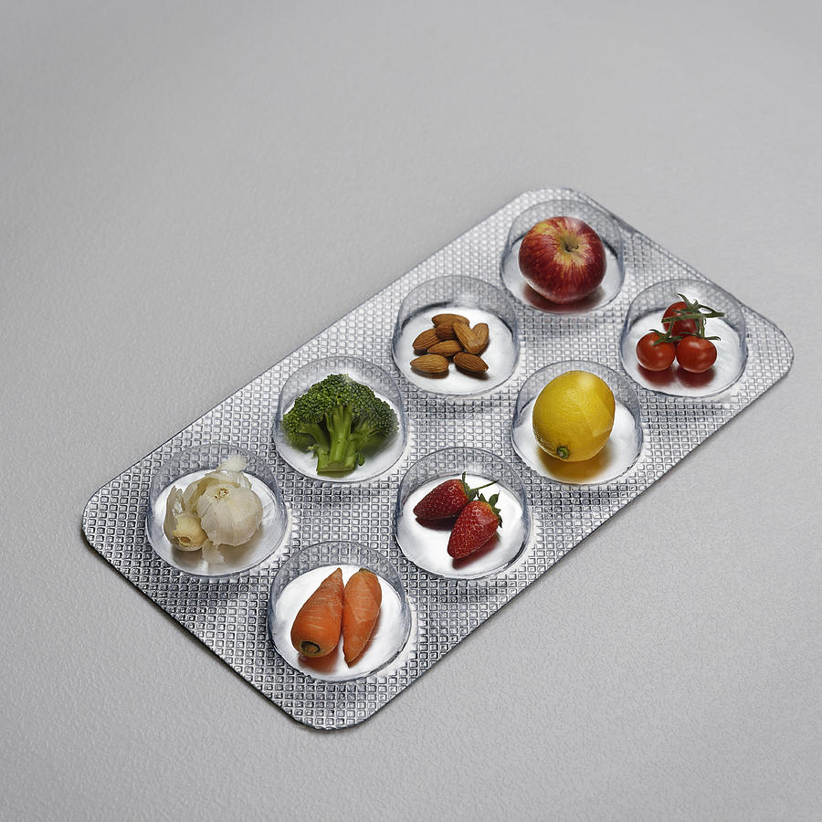 Pill blister pack containing fruit and vegtables Photograph by David Malan