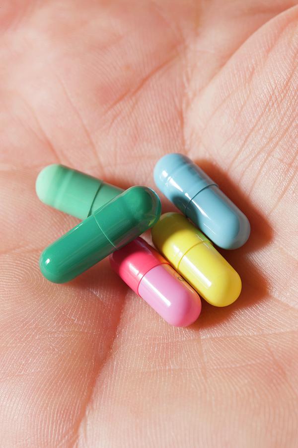 Pills On A Hand Photograph by Cristina Pedrazzini/science Photo Library