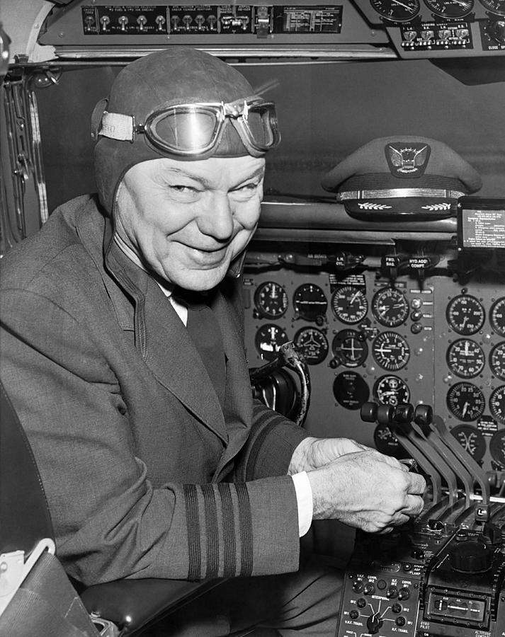 Pilot In Airplane Cockpit Photograph by Underwood Archives