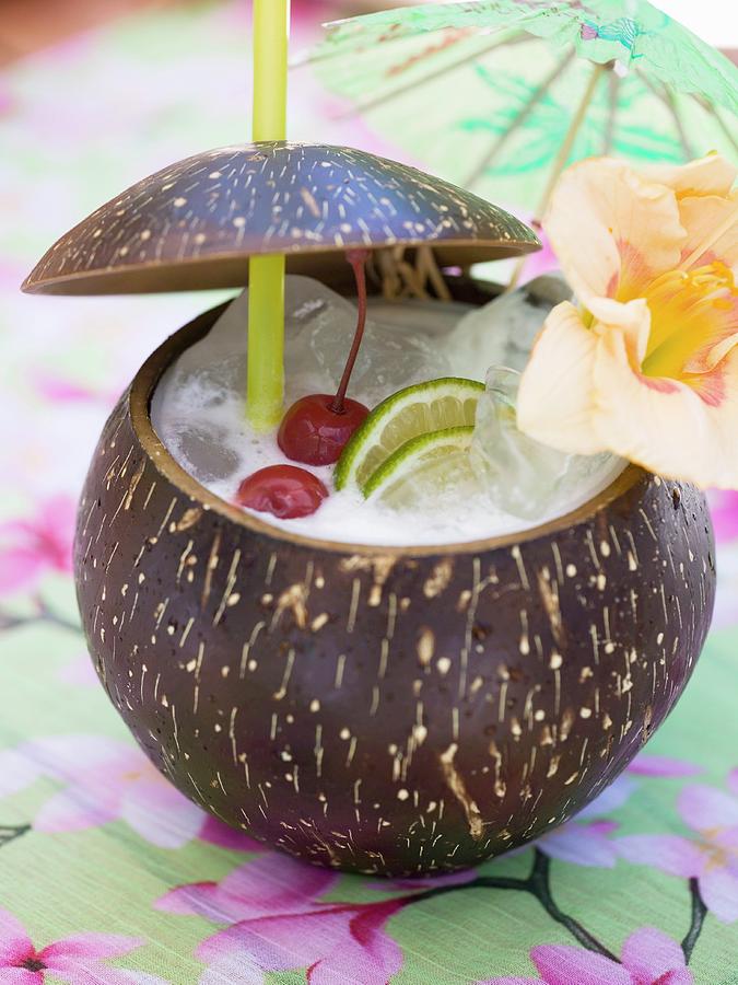 Pina Colada With Cherries, Lime And Flower Photograph By Foodcollection 