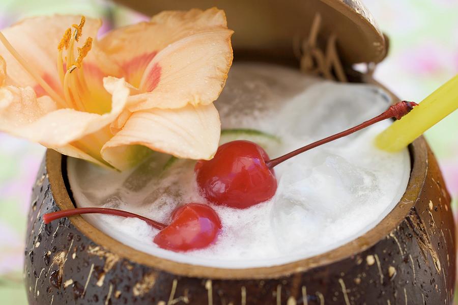 Pina Colada With Flower And Cherries Photograph By Foodcollection 