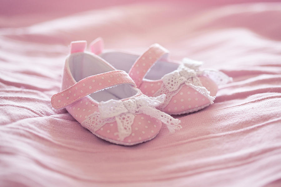 pink baby shoes on pink blanket. Its a girl! Photograph by With love of photography