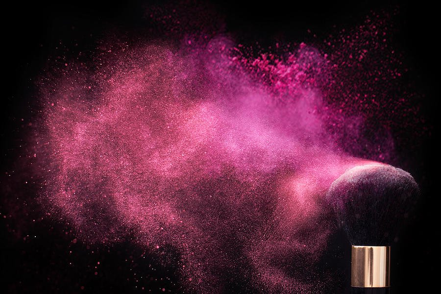 Pink colored face powder exploding Photograph by Emilija Manevska