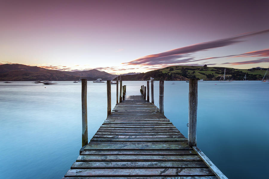 Nature Photograph - Pink Sunset Over Jetty And Blue Lake by Matteo Colombo