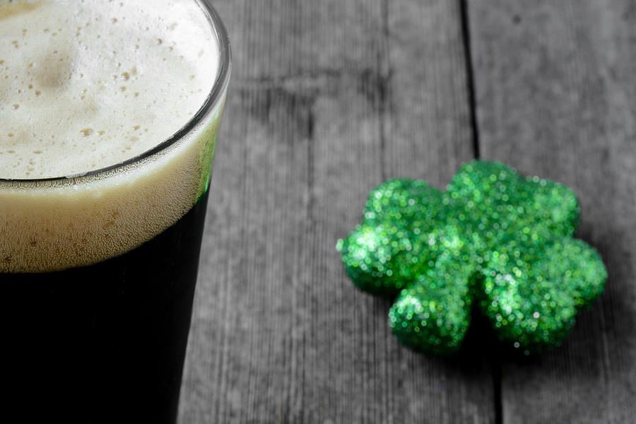 Pint of Stout Beer with Green Shamrock Photograph by Brandon Bourdages