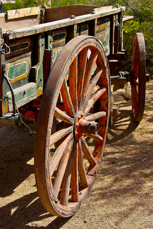 Pioneer Village Wagon Wheels Photograph by John Haldane