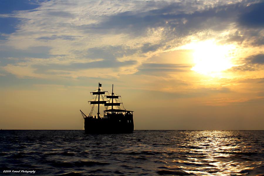 Pirate Ship at Sunset Photograph by Debra Forand