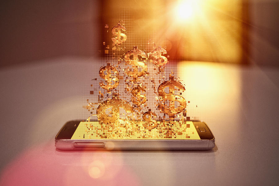 Pixelated dollar signs floating over cell phone Photograph by Donald Iain Smith
