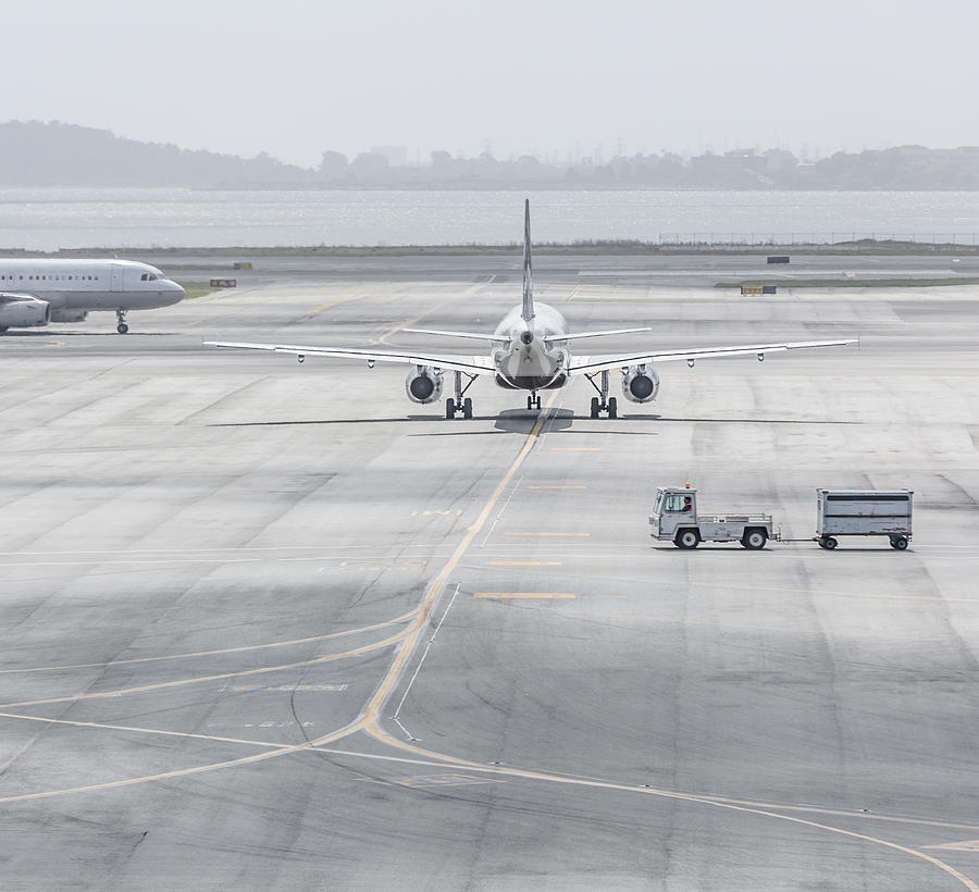 Planes On Airport Runway Photograph by David Madison