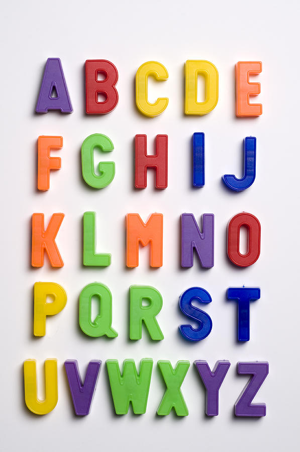 Plastic letters on white background Photograph by Burakpekakcan