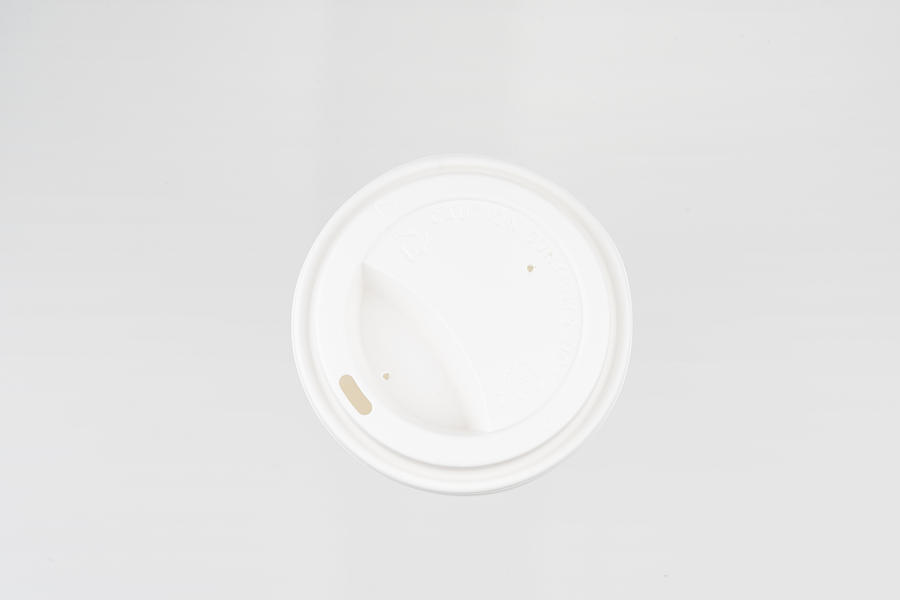 Plastic Lid of Paper Cup Photograph by Copyright Xinzheng. All Rights Reserved.