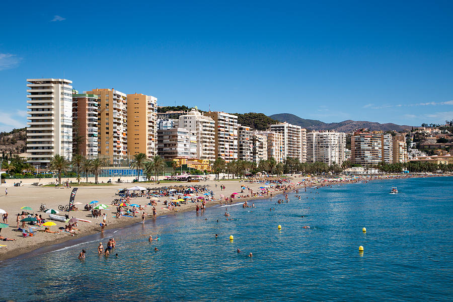 Playa de la Malagueta beach with high-rises Photograph by Holger Leue