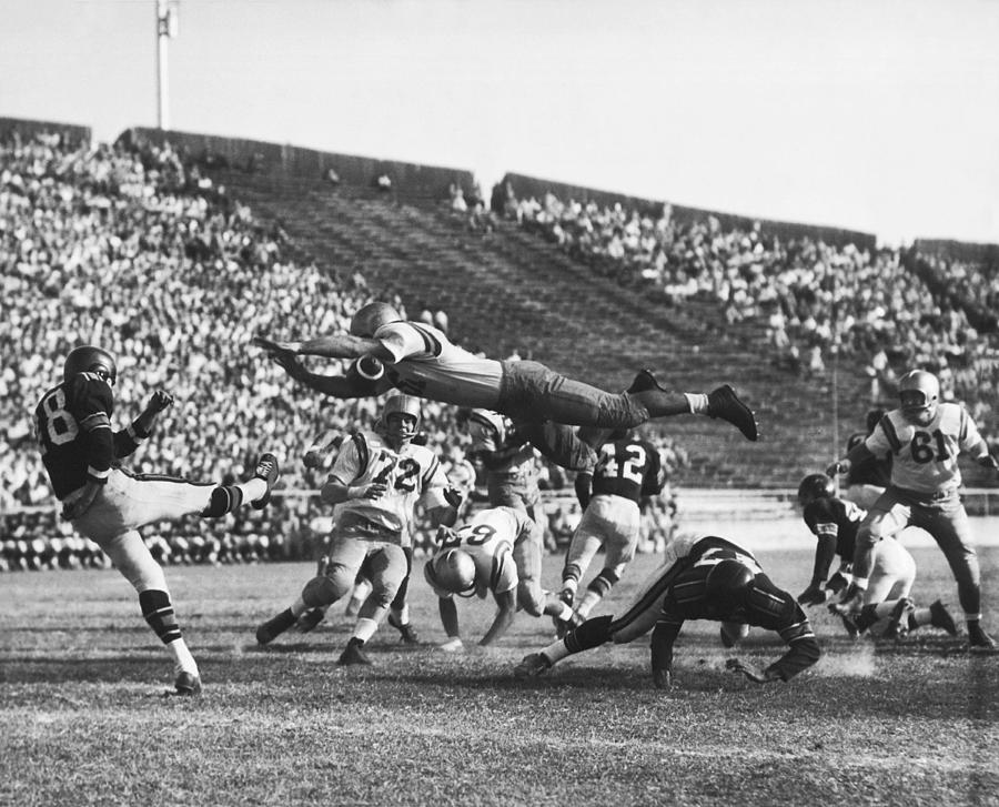 Player Blocks Football Punt Photograph by Underwood Archives