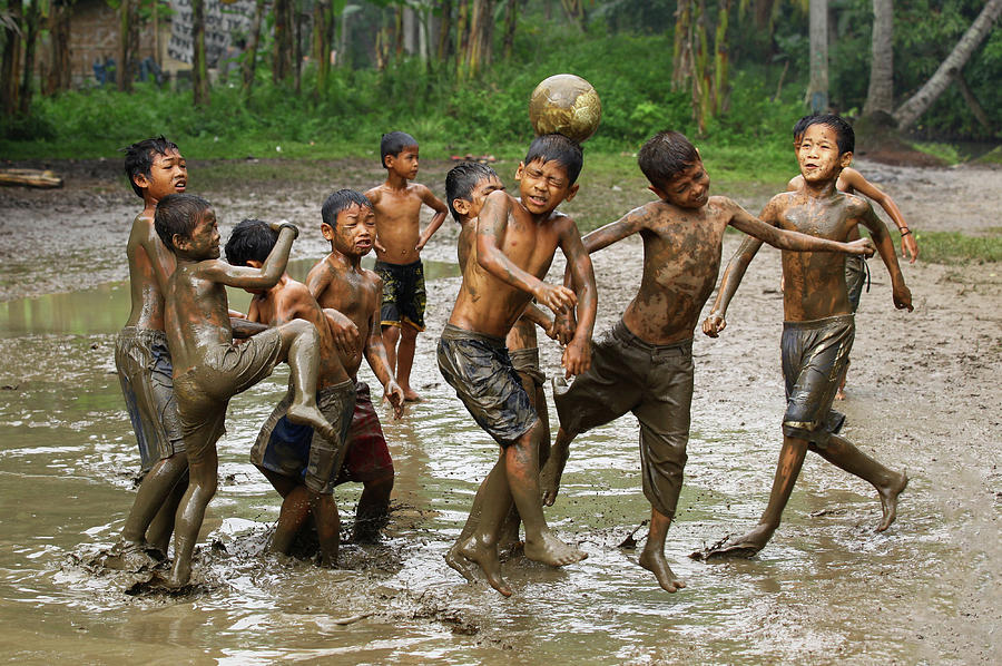 Football Photograph - Playing Football by Angela Muliani Hartojo
