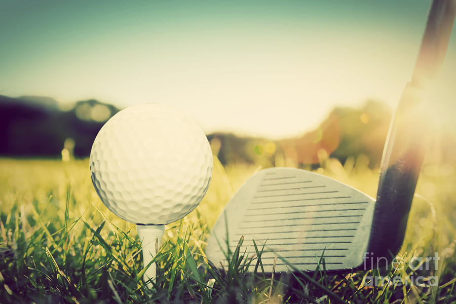 Playing golf ball on tee and golf club Photograph by Michal Bednarek