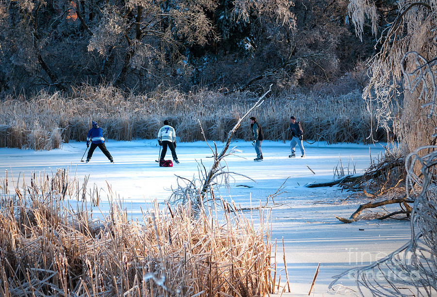 Game of pond hockey  Photograph by Les Palenik