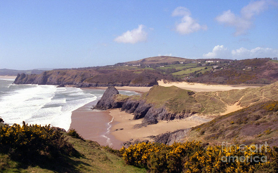 Pobble beach and Three Cliffs Bay Photograph by Paul Cowan