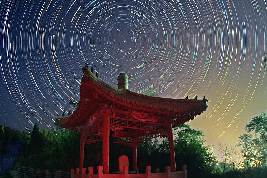 Polar Star Trails Over Pagoda Photograph by Juan Carlos Casado (starryearth.com)