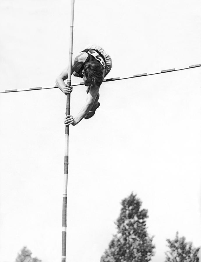 Pole Vaulter Over The Bar Photograph by Underwood Archives