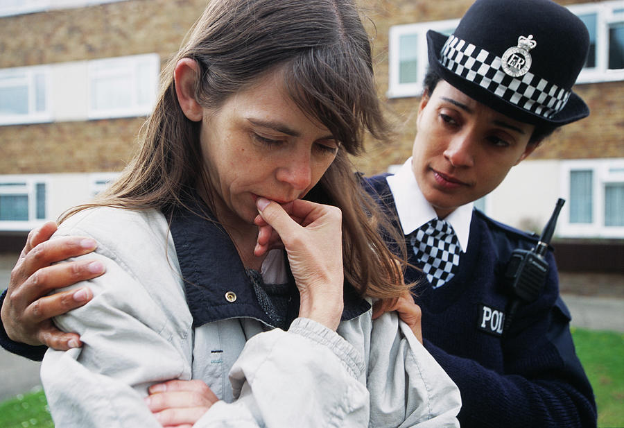 Policewoman Comforting Woman Photograph by Jim Varney/science Photo Library