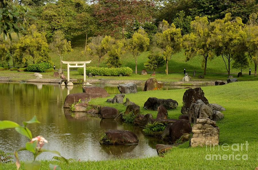 Pond rocks grass and Japanese arch Singapore Photograph by Imran Ahmed