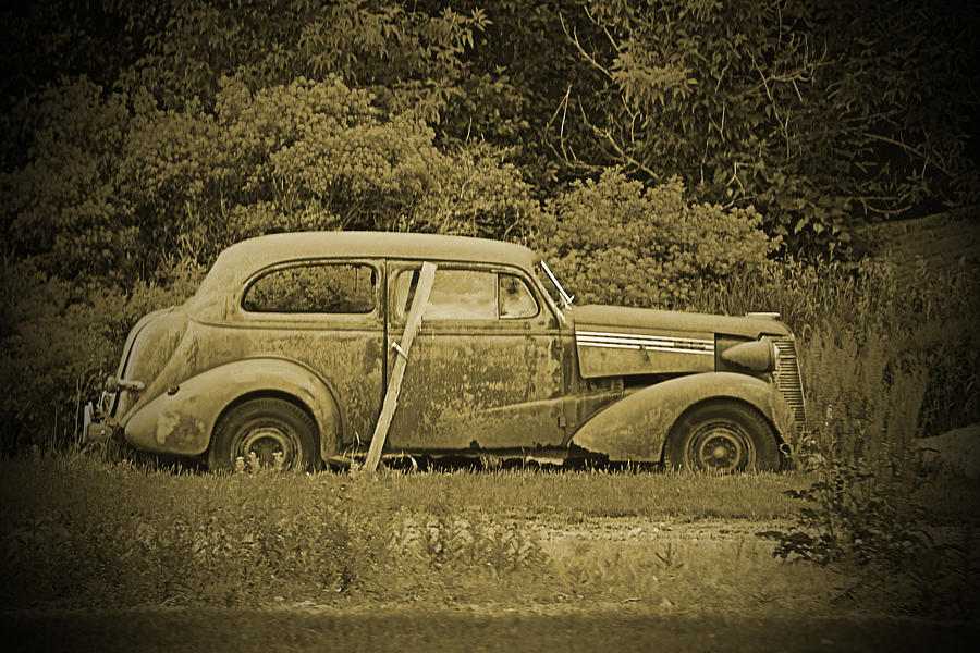 Black And White Photograph - Poor Old Car by Melvin Busch