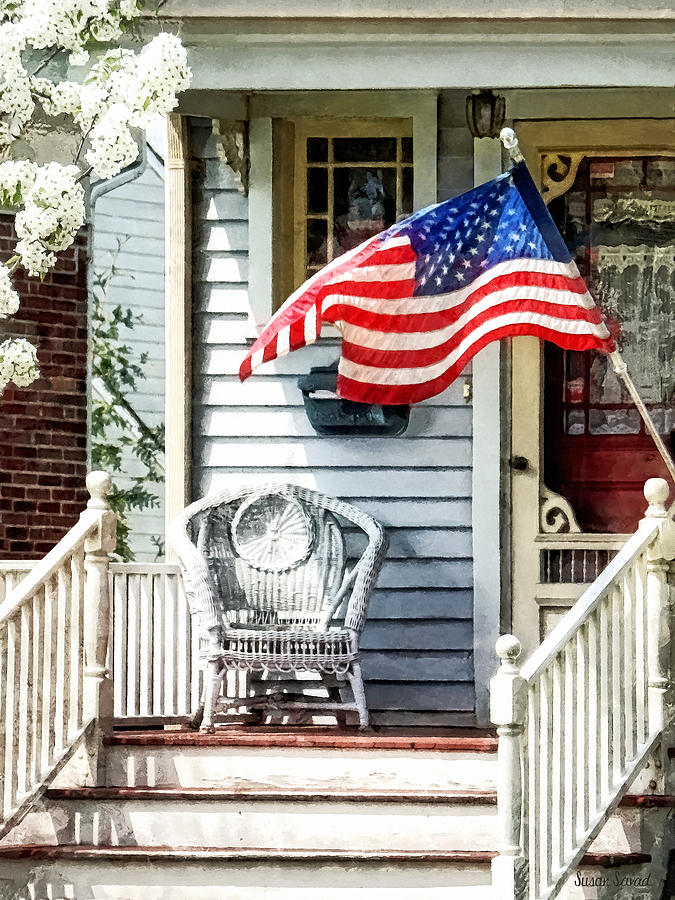 Spring Photograph - Porch With Flag and Wicker Chair by Susan Savad