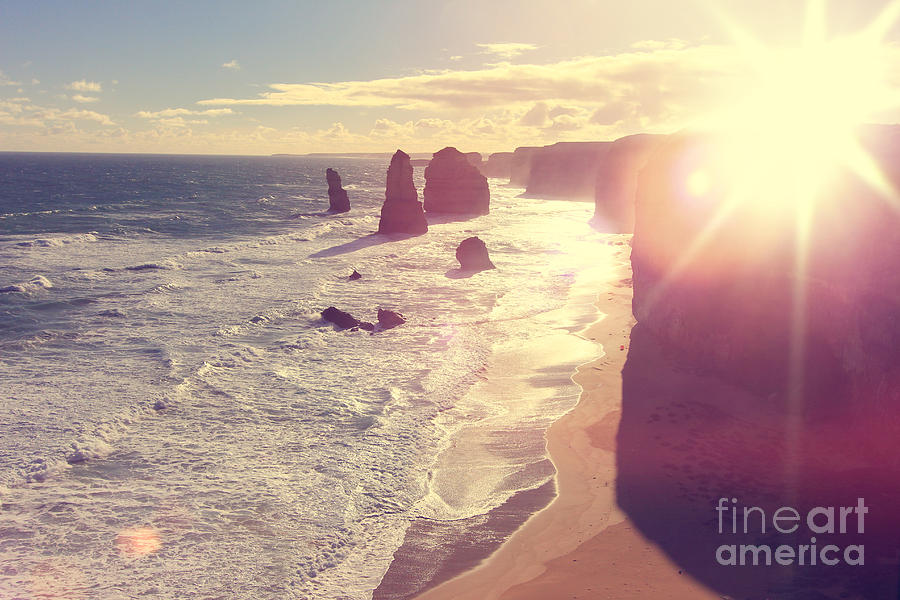 Port Campbell National Park Twelve Apostles with Sun Flare Photograph by Beverly Claire Kaiya