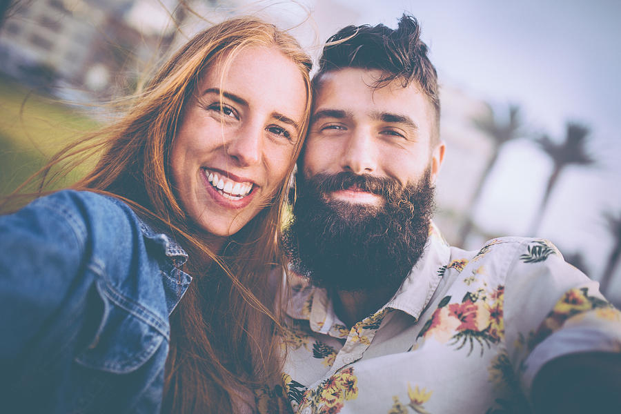 Portrait of a beautiful hipster couple looking happy Photograph by Wundervisuals