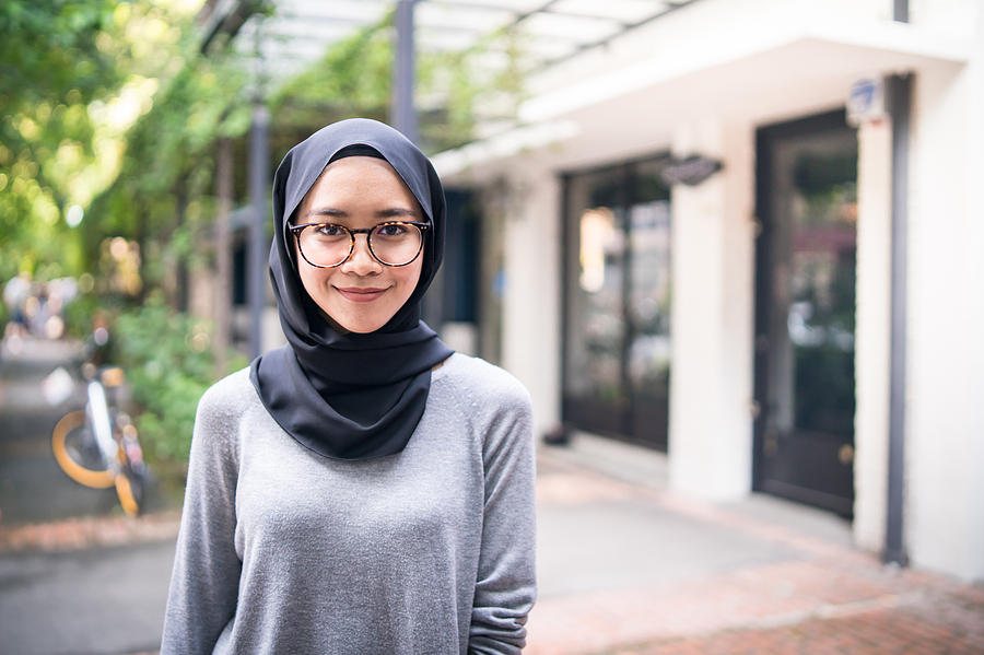 Portrait of a confident Muslim girl Photograph by Yongyuan