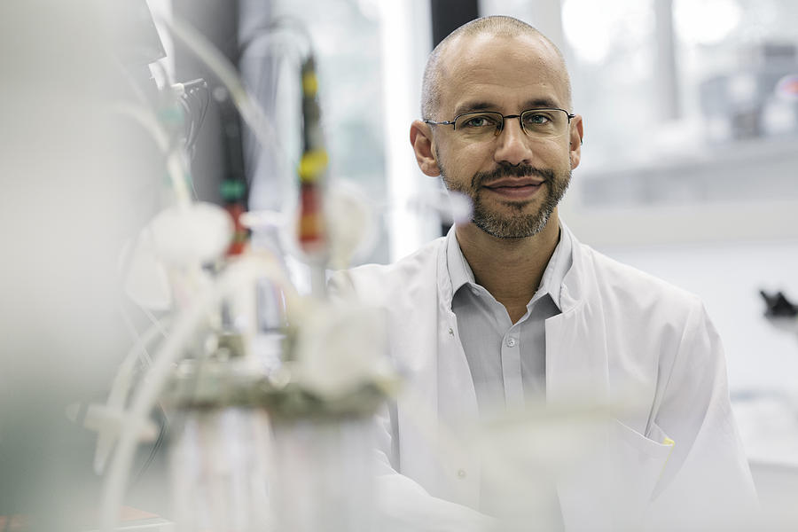 Portrait of a male scientist inside a laboratory Photograph by Hinterhaus Productions