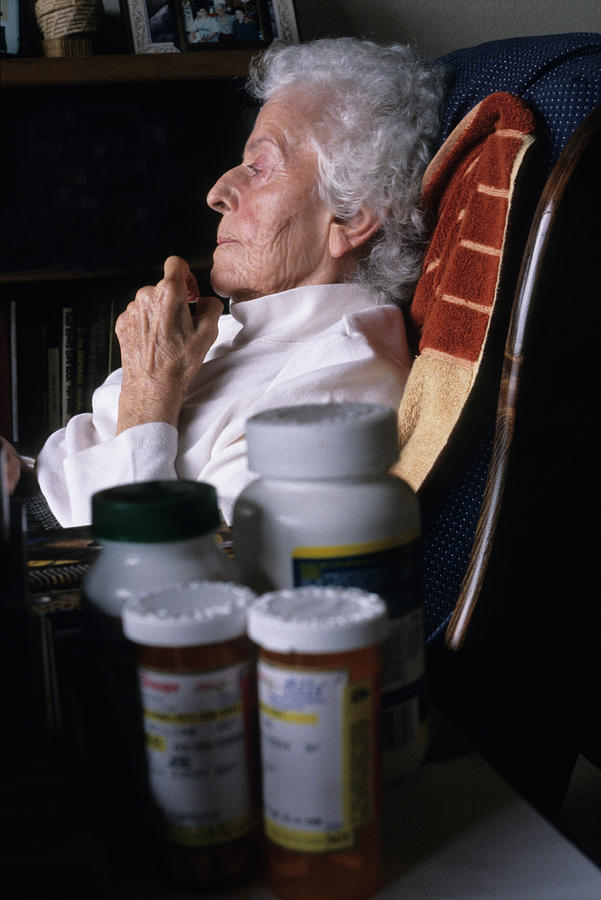 Bottle Photograph - Portrait Of A Seated Elderly Woman by Ron Koeberer