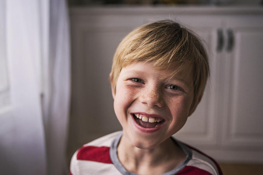 Portrait of a smiling boy with freckles Photograph by Elizabethsalleebauer