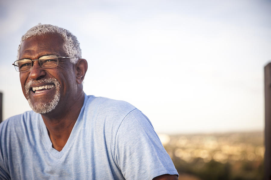Portrait of a Smiling Senior Black Man Photograph by Adamkaz
