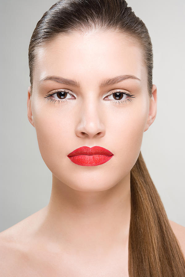 Portrait of a woman wearing red lipstick Photograph by Image Source