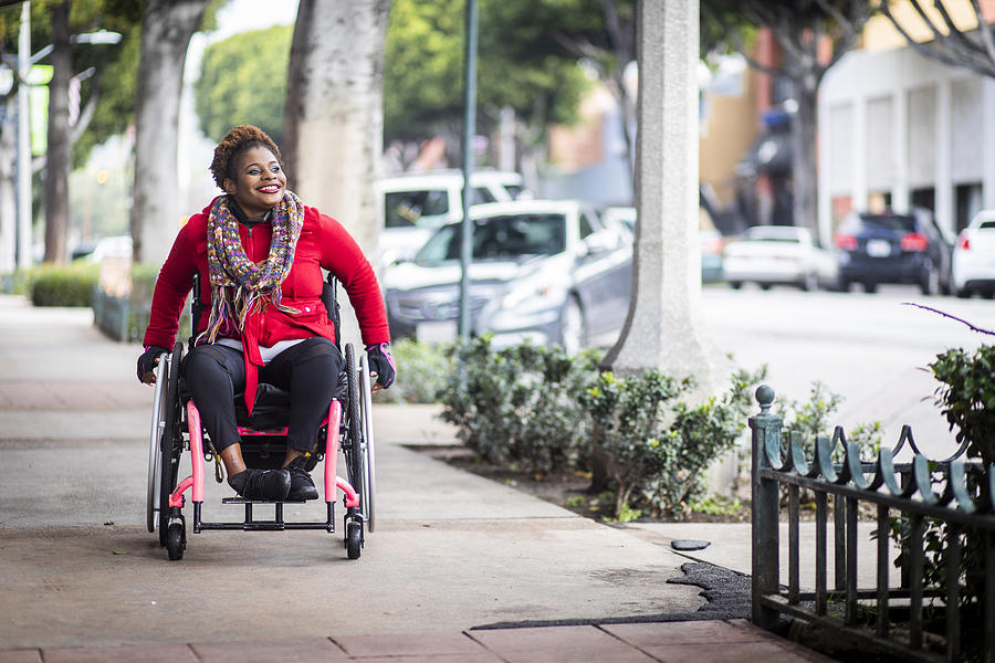 Portrait of a Young Black Woman in a Wheelchair Photograph by Adamkaz