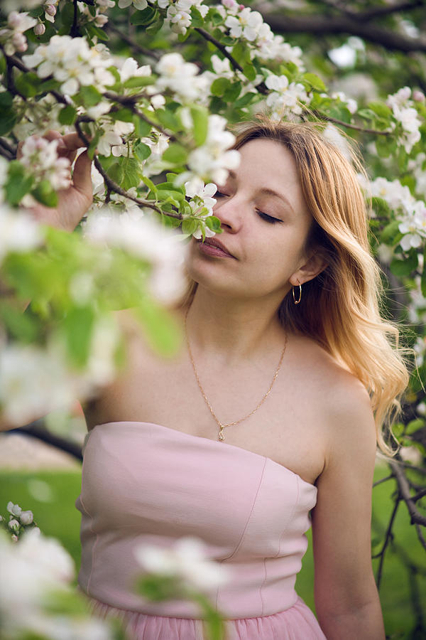 Portrait of beautiful woman in blooming garden Photograph by ArtMarie
