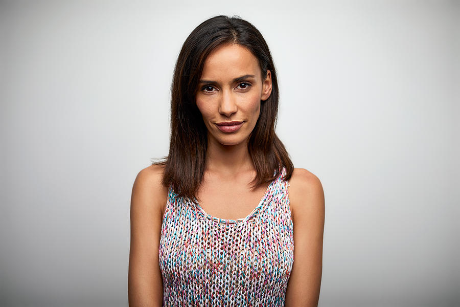 Portrait of confident woman smiling on white Photograph by Morsa Images Portrait of confident woman smiling on white Photograph by Morsa Images