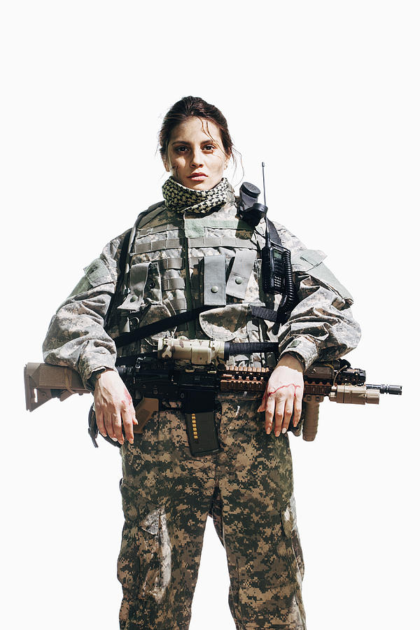 Portrait of female soldier standing with rifle against white background Photograph by Vasily Pindyurin