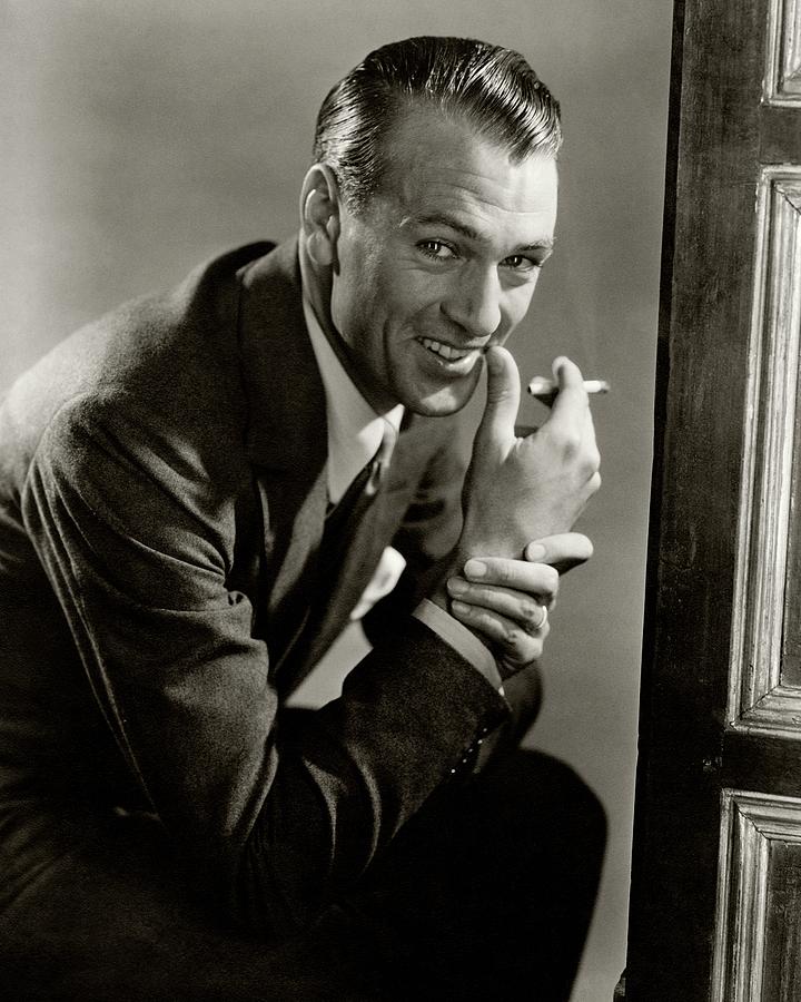 Portrait Of Gary Cooper Holding A Cigarette Photograph by Lusha Nelson