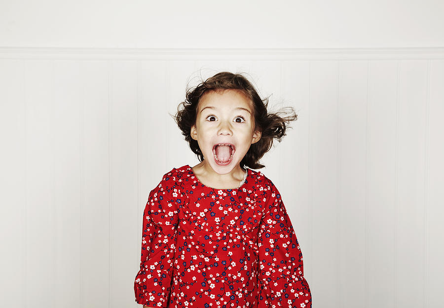 Portrait of girl pulling funny faces Photograph by Flashpop