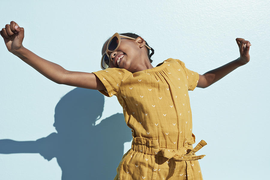 Portrait of jumping cool girl with sunglasses Photograph by Klaus Vedfelt