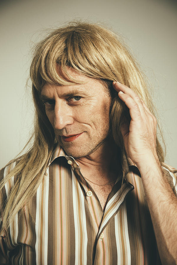 Portrait of man cross-dressed as blond woman Photograph by Westend61