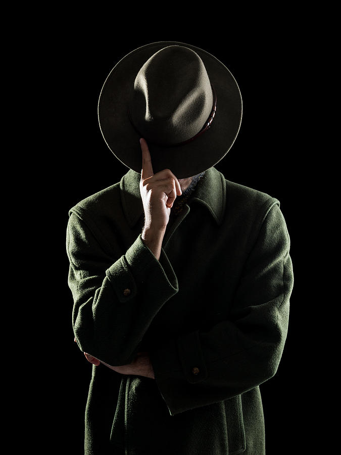 Portrait Of Man Hiding His Face With Fedora Hat Photograph by Selimaksan