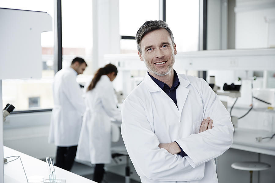 Portrait of man working in laboratory Photograph by Thomas Tolstrup
