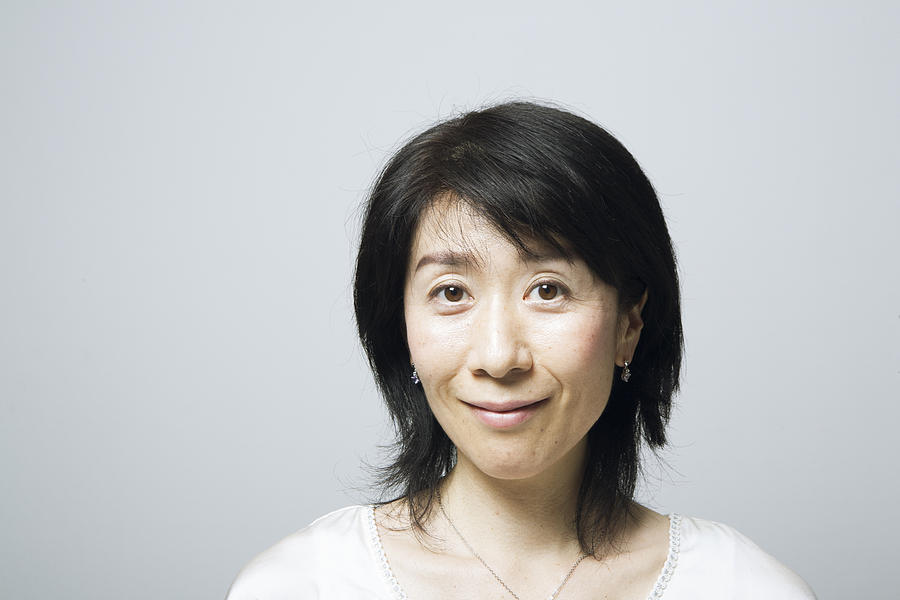 Portrait of middle aged woman,smiling Photograph by Atsushi Yamada